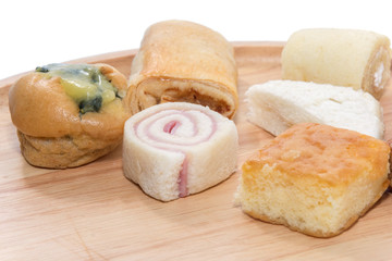 a variety of bakery on wooden plate