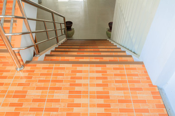 stairs tile orange walkway down. select focus with shallow depth of field