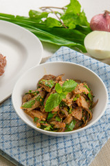 Nam Tok or Spicy Grilled Beef Salad Served with Lettuce Leaves