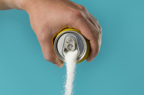 Man Hand Holding Refresh Drink Can Pouring Sugar Stream In Sweet And Calories Content Of Soda And Energy Drinks