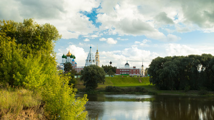 Beautiful Landscape Of Various Temples And Belltower On Assumption Cathedral Square Under Blue Sky With Dramatic Clouds By Embankment River Summer In Kolomna, Moscow Region.