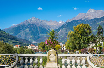 Merano in South Tyrol, a beautiful city of Trentino Alto Adige, View on the famous promenade along the Passirio river. Italy. - obrazy, fototapety, plakaty