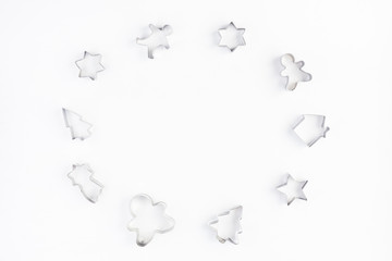 Cookie cutters on white background. Christmas, winter, new year concept. Flat lay, top view, copy space