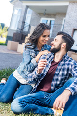 young couple relaxing in garden