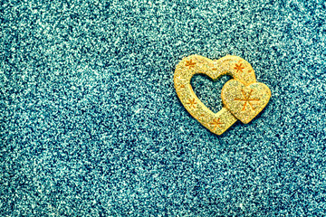 Abstraction, a hot heart in a cold winter. Heart on a brilliant turquoise background.