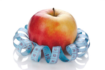 blue measure tape and red apple  isolated