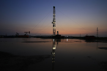 Oil drilling platform in the beautiful night