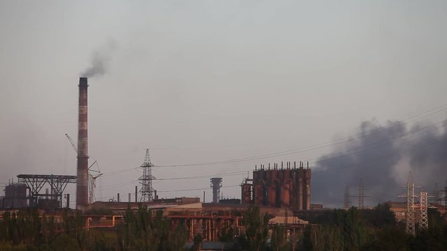Air pollution industrial factory. Pipes with smoke in the sky