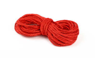Red jute twine coil skein isolated on white