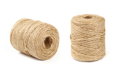 Two coil bobbins of burlap jute twine over white