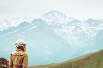 Traveler Woman enjoying Caucasus Mountains range landscape Travel Lifestyle concept Summer trip vacations outdoor
