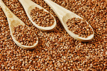 buckwheat groats and wooden spoon