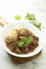 Traditional homemad beef goulash with dumplings