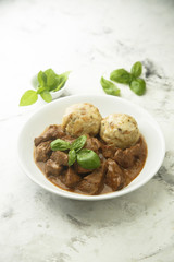 Traditional homemad beef goulash with dumplings