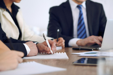 Group of business people or lawyers  at meeting, hands close-up