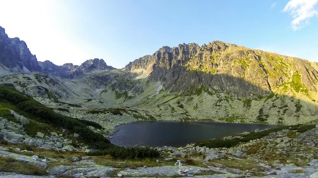 Evening view of Batizovske Pleso lake in High Tatras mountains, Slovakia. Mount Batizovsky Stit (2448m) in the center. Time Lapse