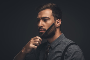 man grooming beard