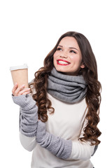 Cheerful woman holding paper cup