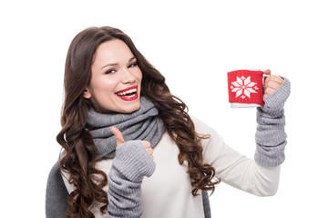 woman with cup showing thumb up - obrazy, fototapety, plakaty