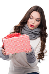 Excited woman holding gift box