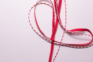 Red ribbon on paper background