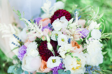 Wedding bouquet, flowers on green grass