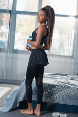 athletic woman with bottle of water