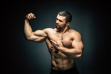 Fototapeta na wymiar shirtless sportive man showing muscles