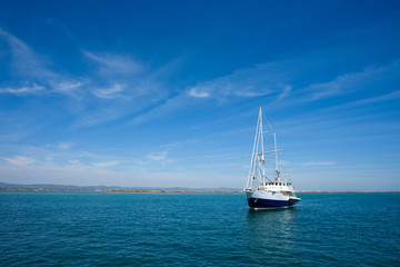 Fototapeta premium White yacht in the sea at summer day