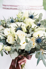 wedding bouquet in bride's hands close-up