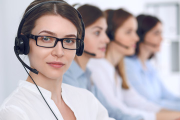 Call center operator.Young beautiful business woman in headset