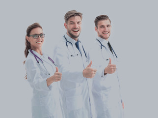 Team of medical professionals  looking at camera, showing thumbs