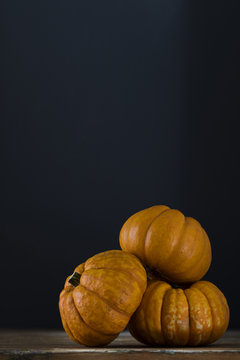 Autumn pumpkins against a dark background