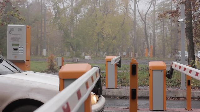 checkpoint three posts. Automatic road barrier gate lifting gate opens and passes car