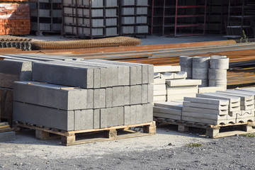 Warehouse cinder block and products from cement slurry on the base.