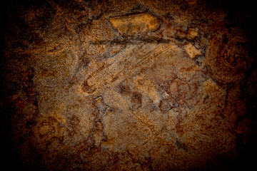 Vignetted stone wall background with lots of texture