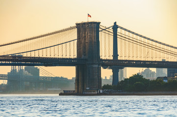 Colors of sunrise over Brooklyn Bridge, New York, USA