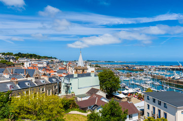 High Angle view over Saint Peter Port and its harbor and marina. Guernsey, Channel Islands, UK