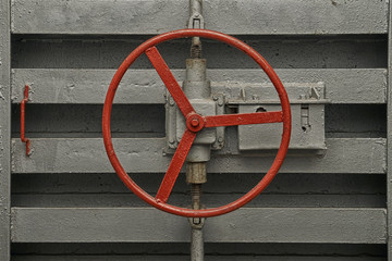 Round handle of the lock of hermetic door of old bomb shelter