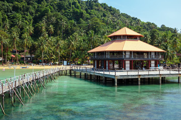 Wooden jetty on exotic beach Koh Chang island, Thailand