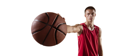 Basketball player hold a basketball ball. Isolated basketball player on a white background. Player wears unbranded clothes.