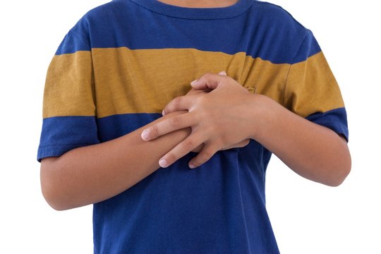 Mid-section of boy having an chest pain