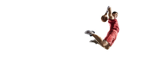 Basketball player makes slam dunk. Isolated basketball player on a white background. Player wears unbranded clothes. © Alex