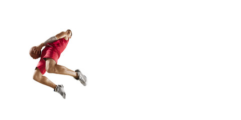 Basketball player makes slam dunk. Isolated basketball player on a white background. Player wears...