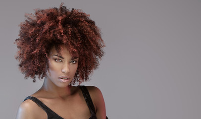 Beautiful woman with afro hairstyle posing.