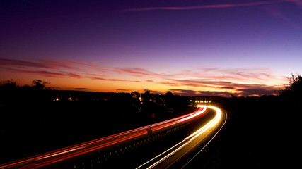 Fototapeta na wymiar Light trails on a clear evening in October, under a harvest moon