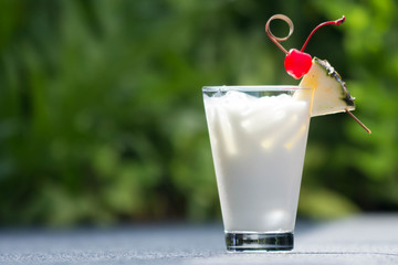 Pina corada cocktail with cherry
