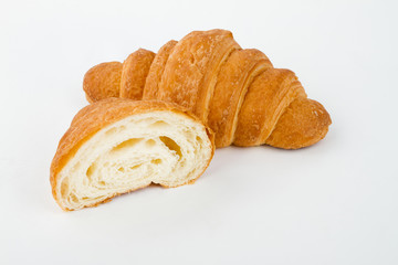 Delicious croissants with cherry jam on a white background