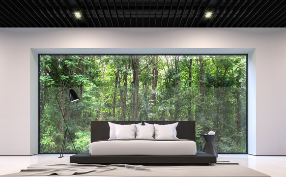 Modern black and white bedroom with forest view 3d rendering image.There are large window overlooking the surrounding garden and nature