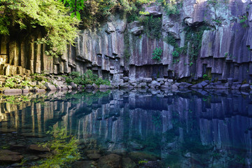 Fototapeta na wymiar The Cheonjeyeon Waterfall Pond on Jeju Island in South Korea 